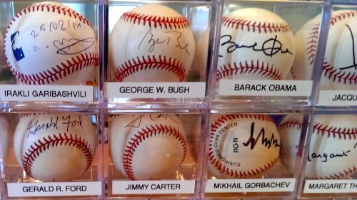 Some of the top names from the autograph collection of Randy Kaplan. He launched his collection in 1996, with the autograph of Bill Clinton, and has gathered 130 autographed baseballs to date. (Photo: Alina Simone)