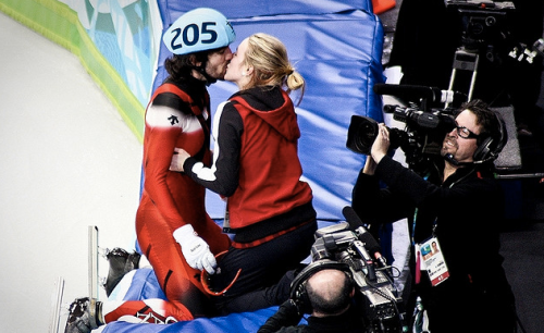 Charles Hamelin kisses girlfriend Marianne St-Gelais after winning the gold at the 2010 Winter Olympics (Francesco Cataldo/Flickr)