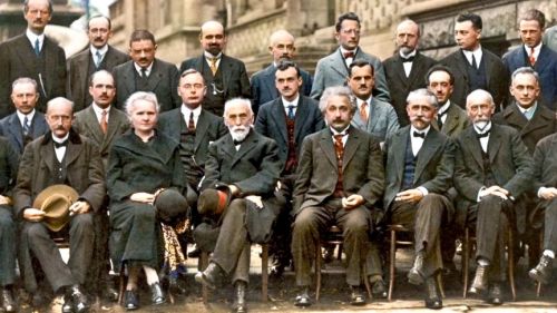 The Fifth Solvay International Conference on Electrons and Photons, 1927. Hendrik Lorentz, Leiden University, seated between Madame Curie and Einstein, chaired the conference. (Photo: iharsten via Flickr)